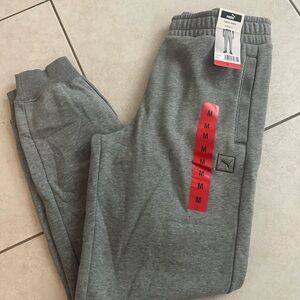 Puma Men's Gray Fleece Joggers with pockets.